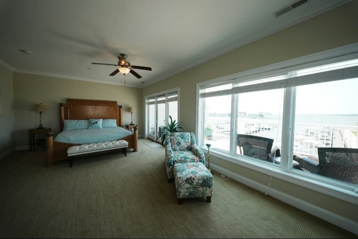 Mid bracket exposure of a bedroom with a harbor view